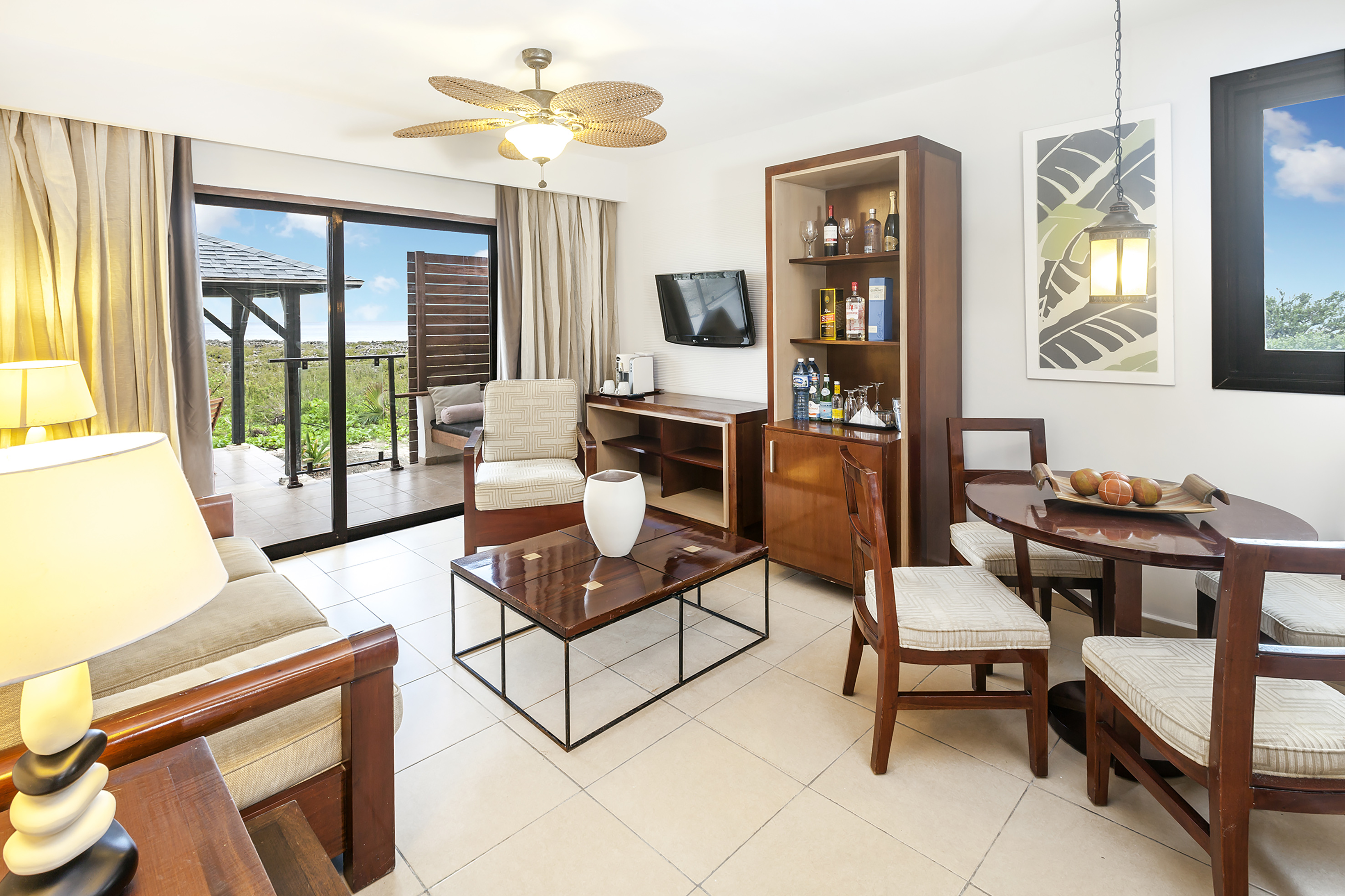a living room with a television and a table