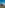 a group of red houses with trees in the background
