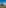 a group of red houses with trees in the background