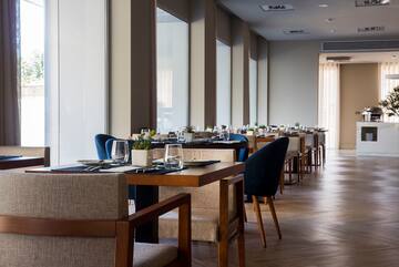 a restaurant with tables and chairs