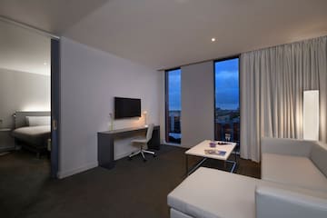 a room with a tv and couches