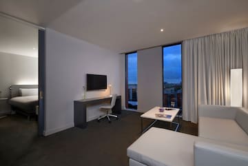 a room with a tv and couches