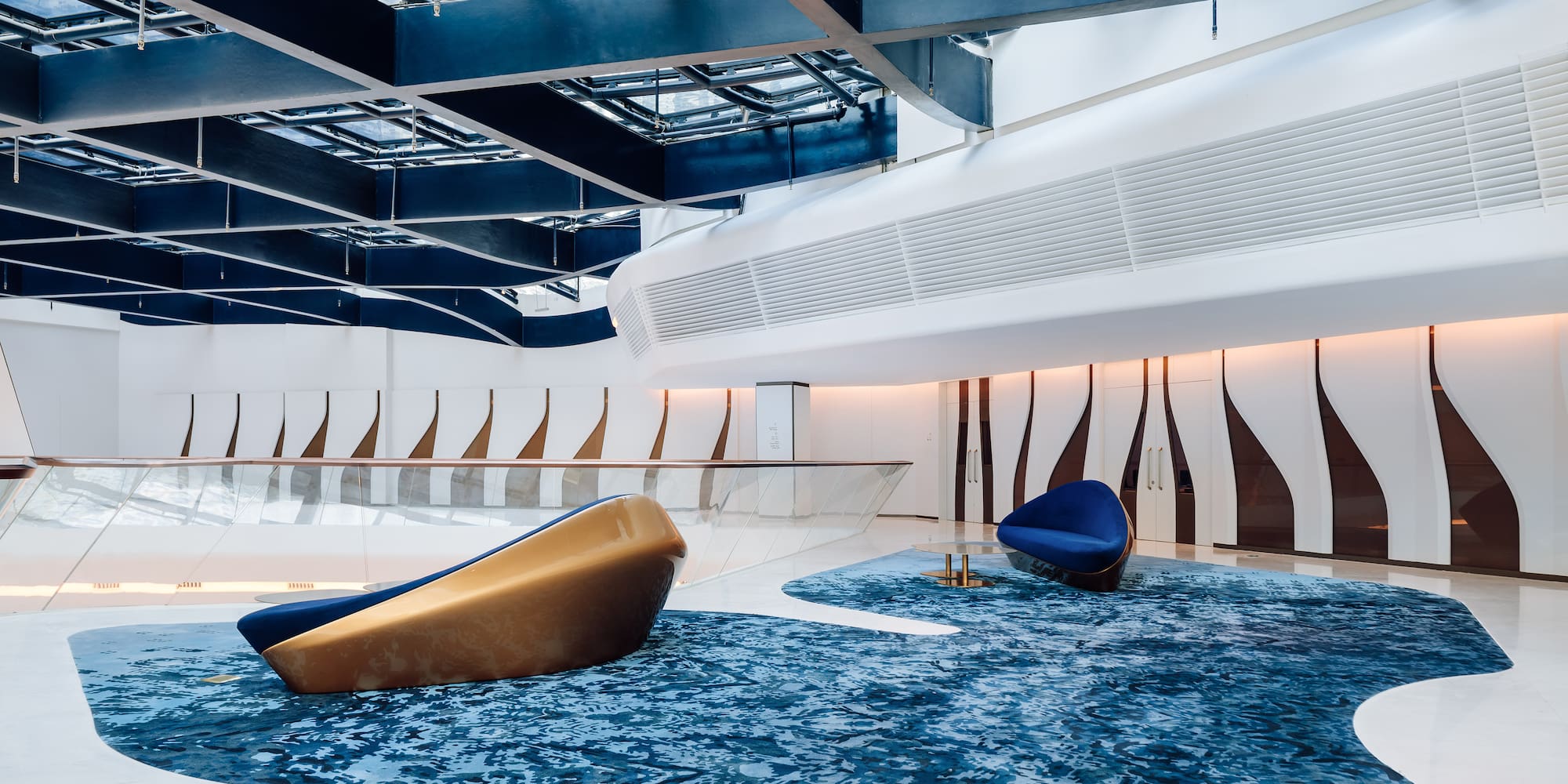 a blue carpet in a room with a blue and white floor