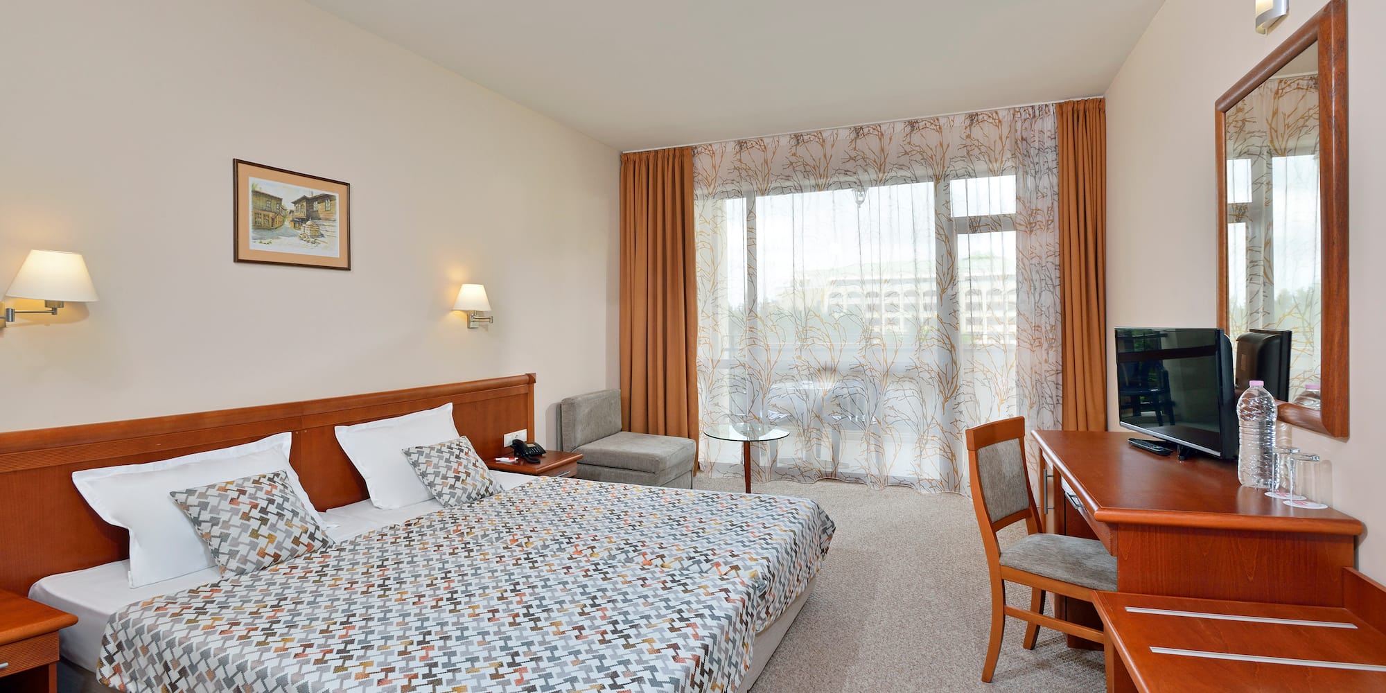 a bedroom with a bed and a desk