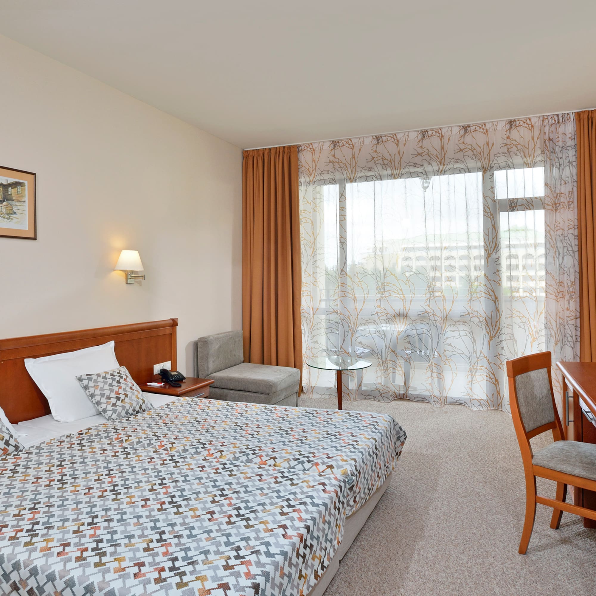 a bedroom with a bed and a desk