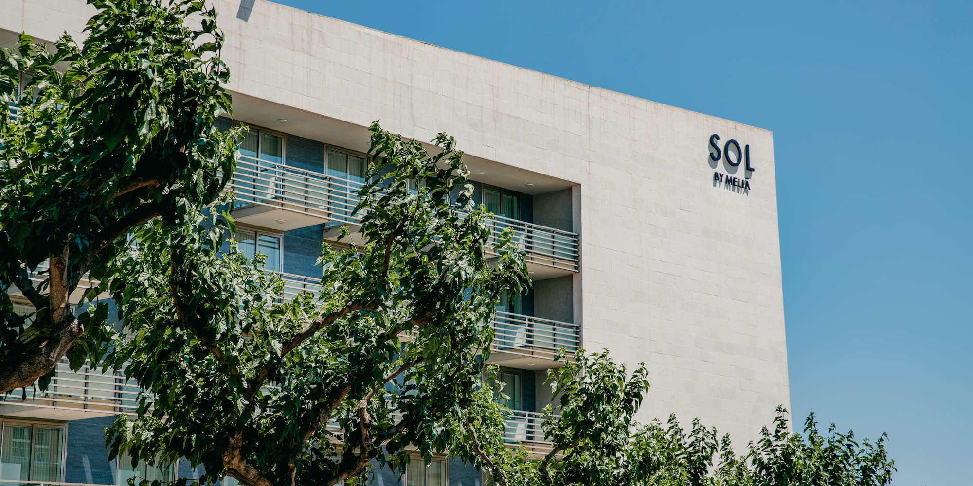 a building with trees in front of it
