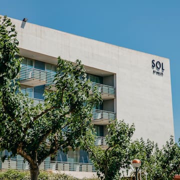 a building with trees in front of it