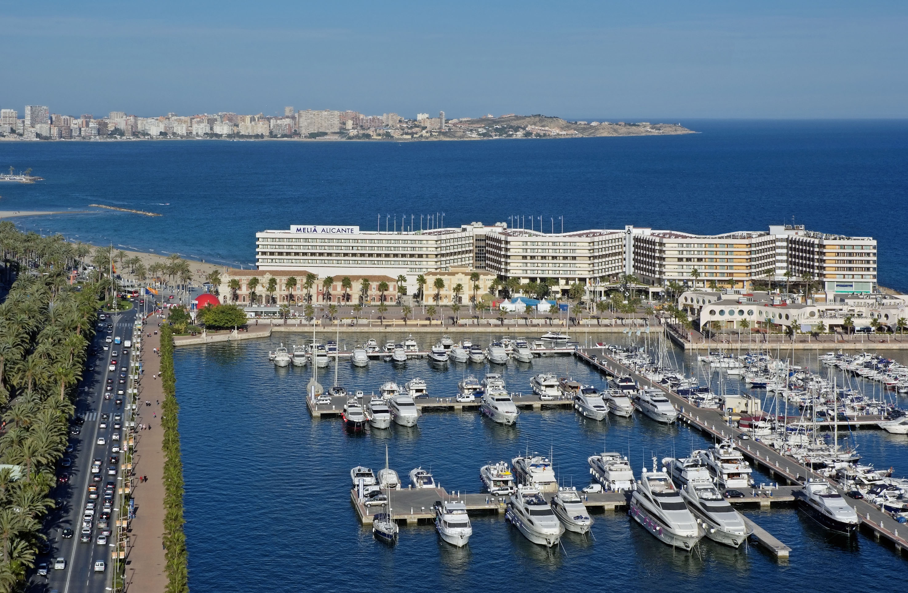 a marina with many boats and buildings in the background