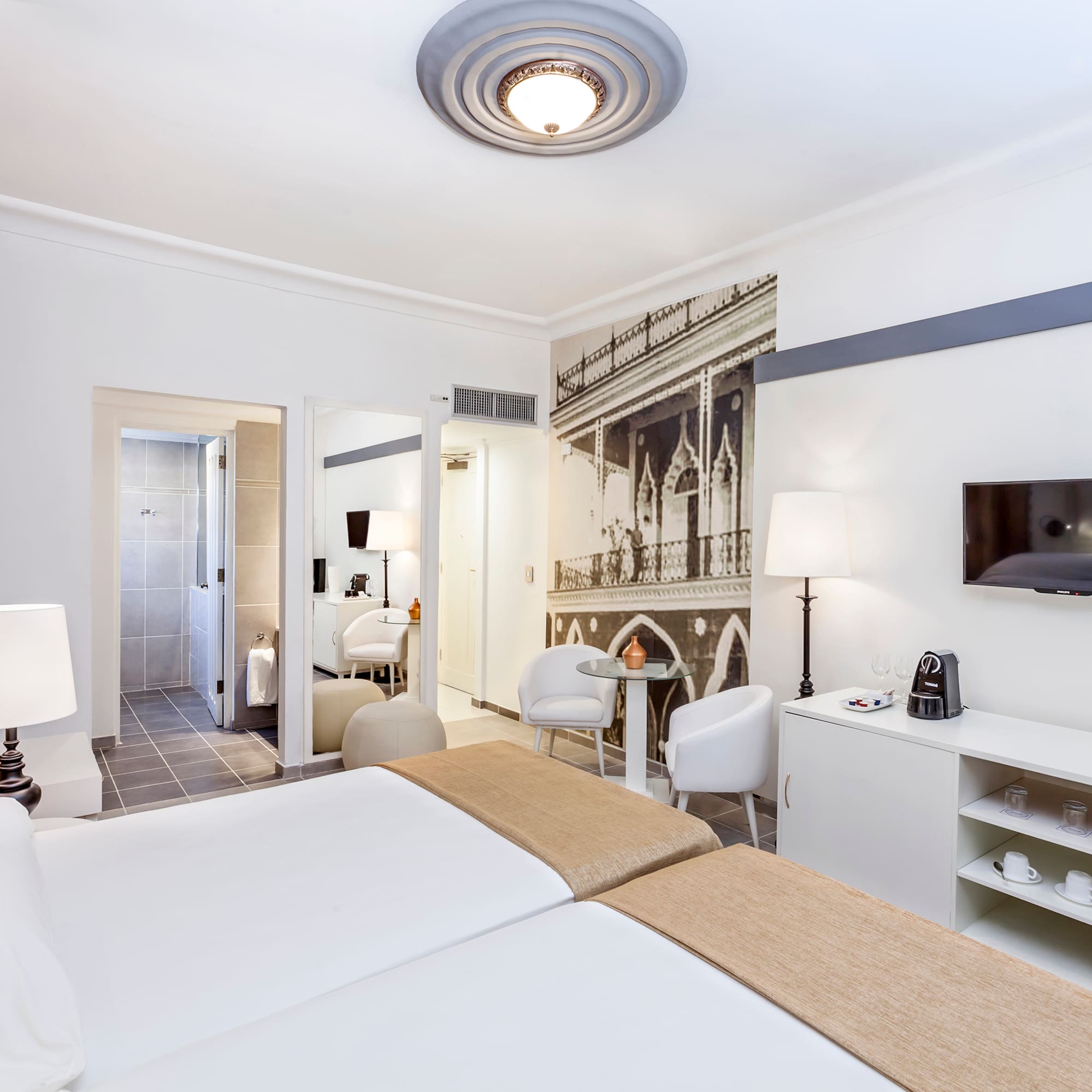 a room with a bed and a tv