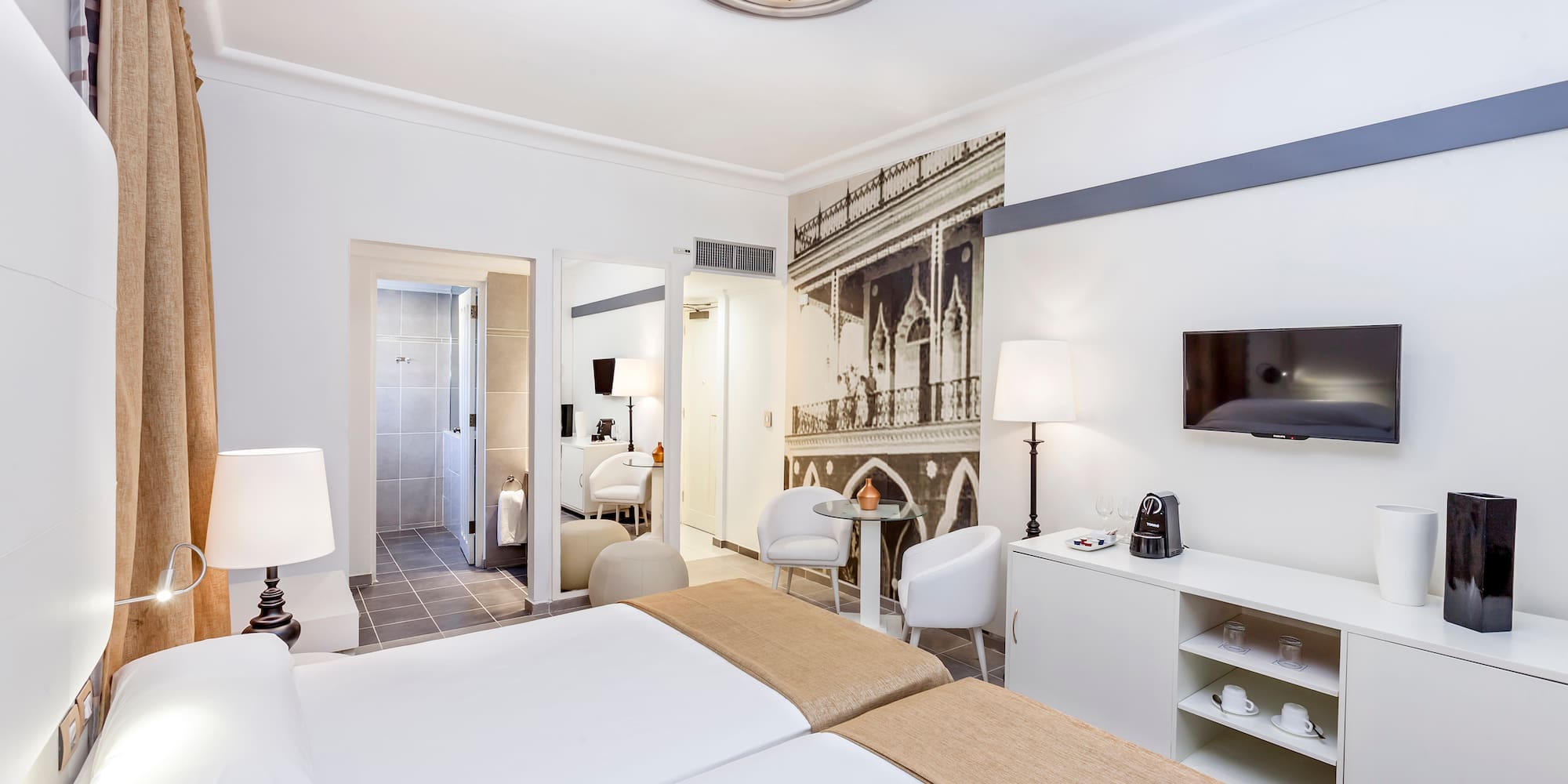 a room with a bed and a tv