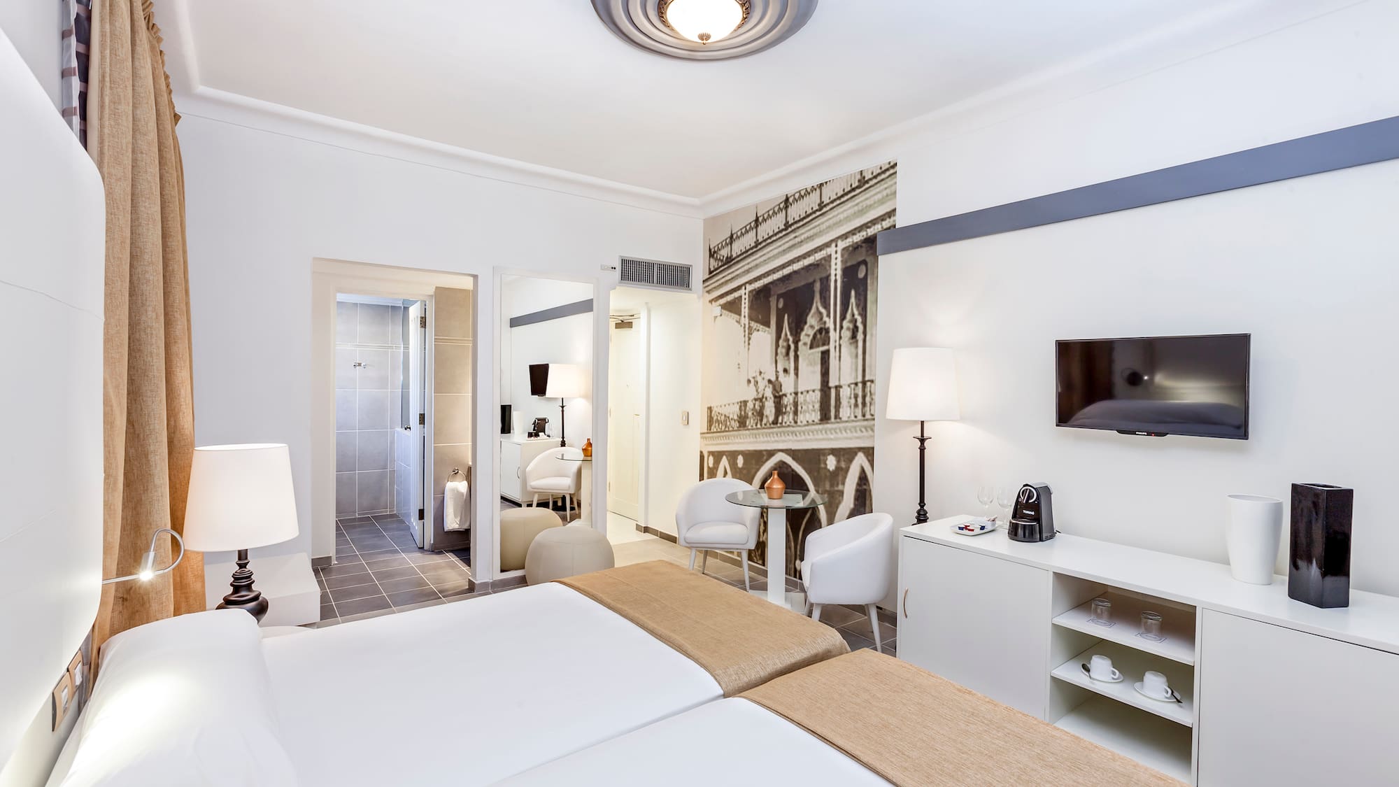 a room with a bed and a tv