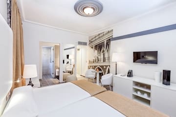 a room with a bed and a tv