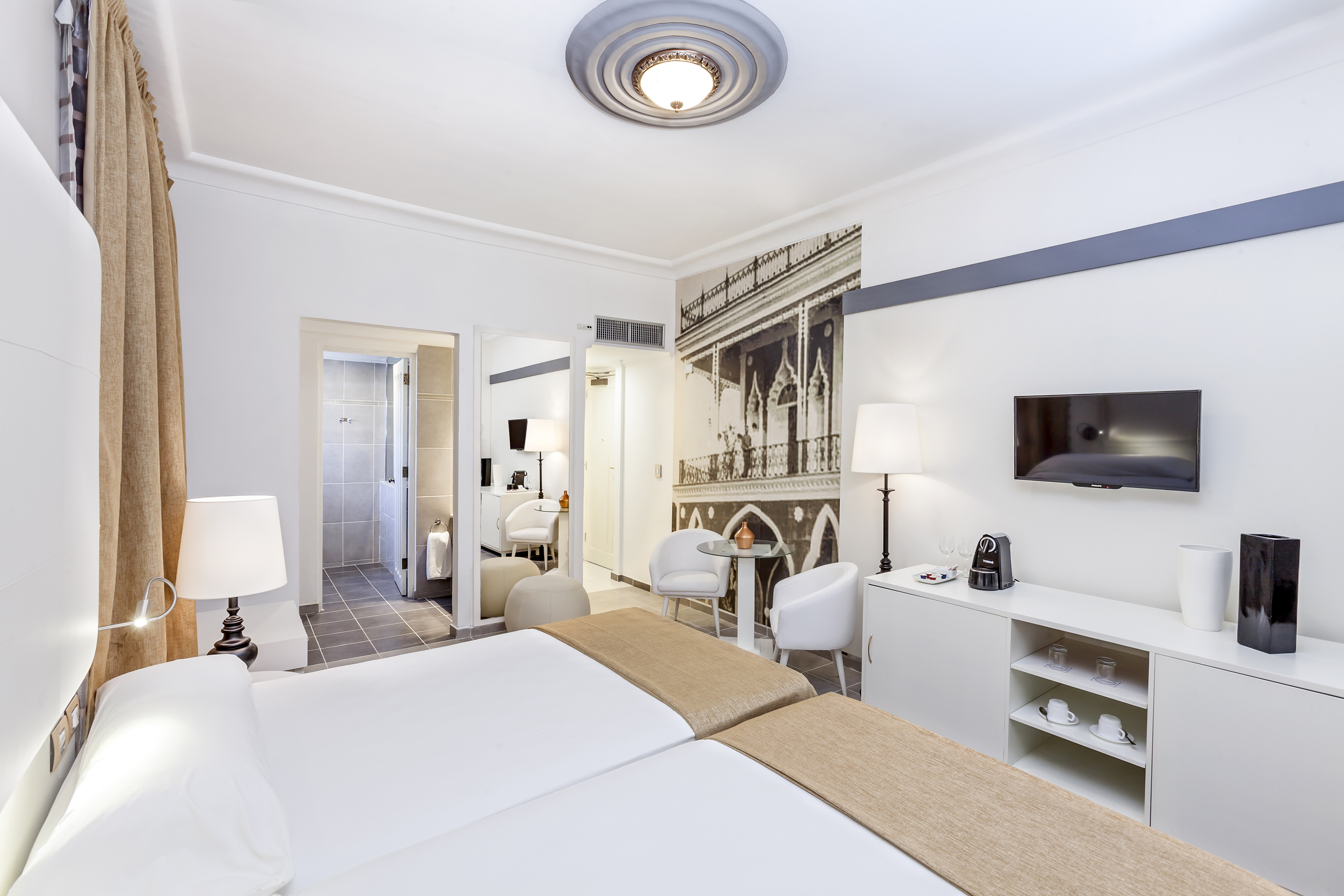 a room with a bed and a tv