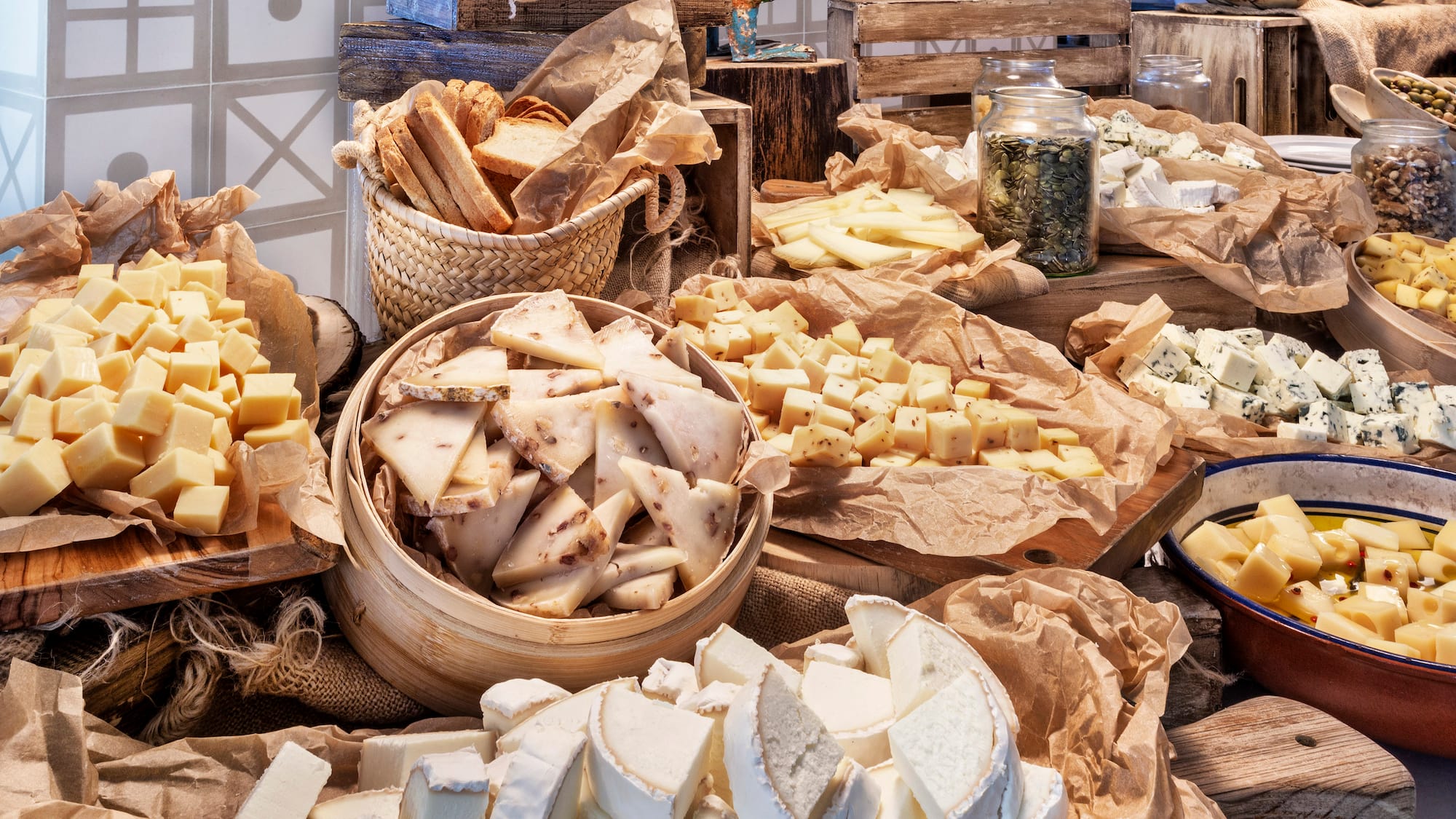 a table full of different types of cheese