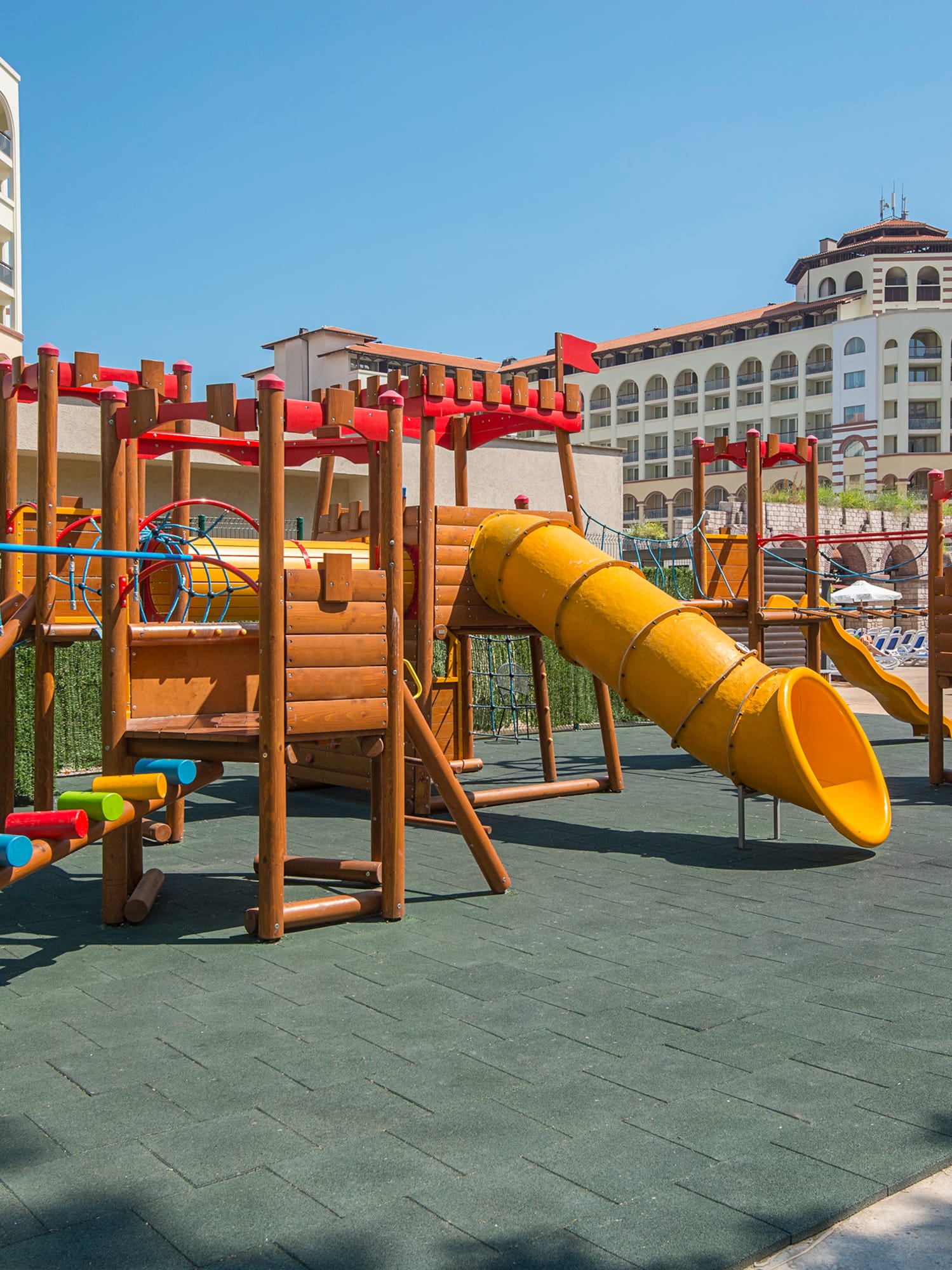 a playground with a slide and a slide