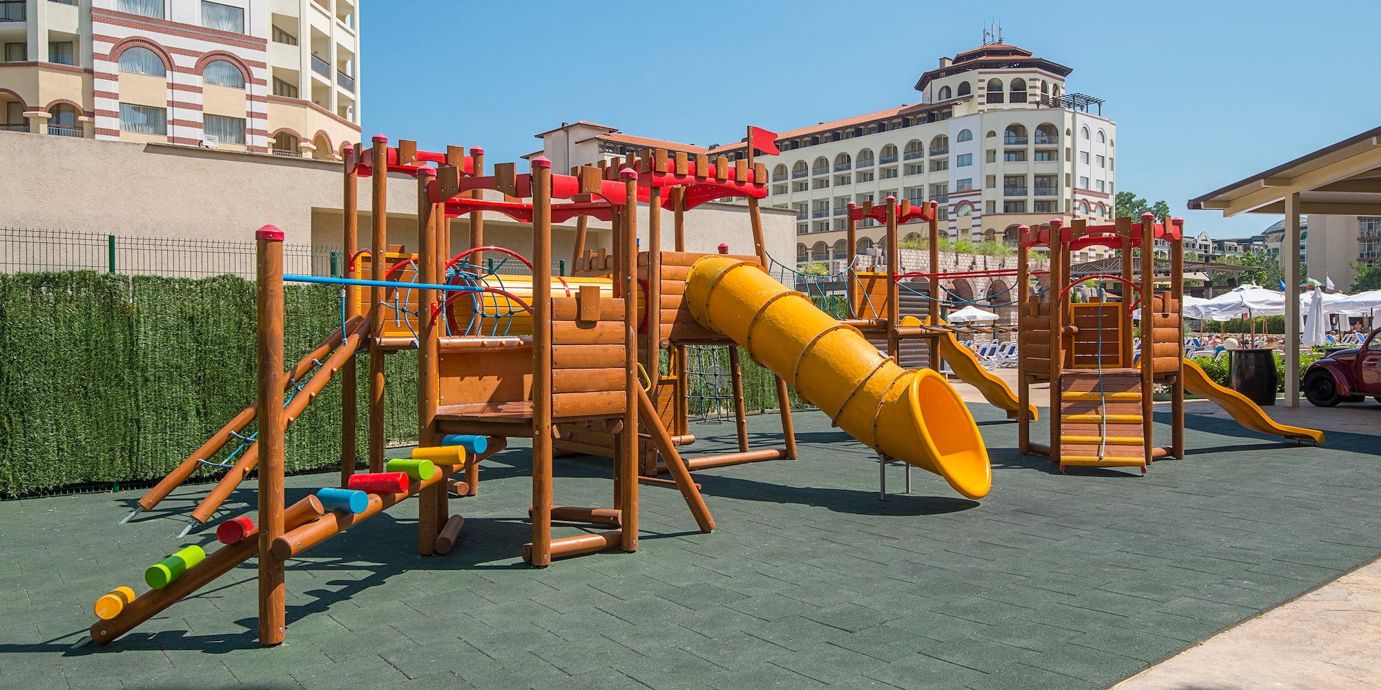 a playground with a slide and a slide