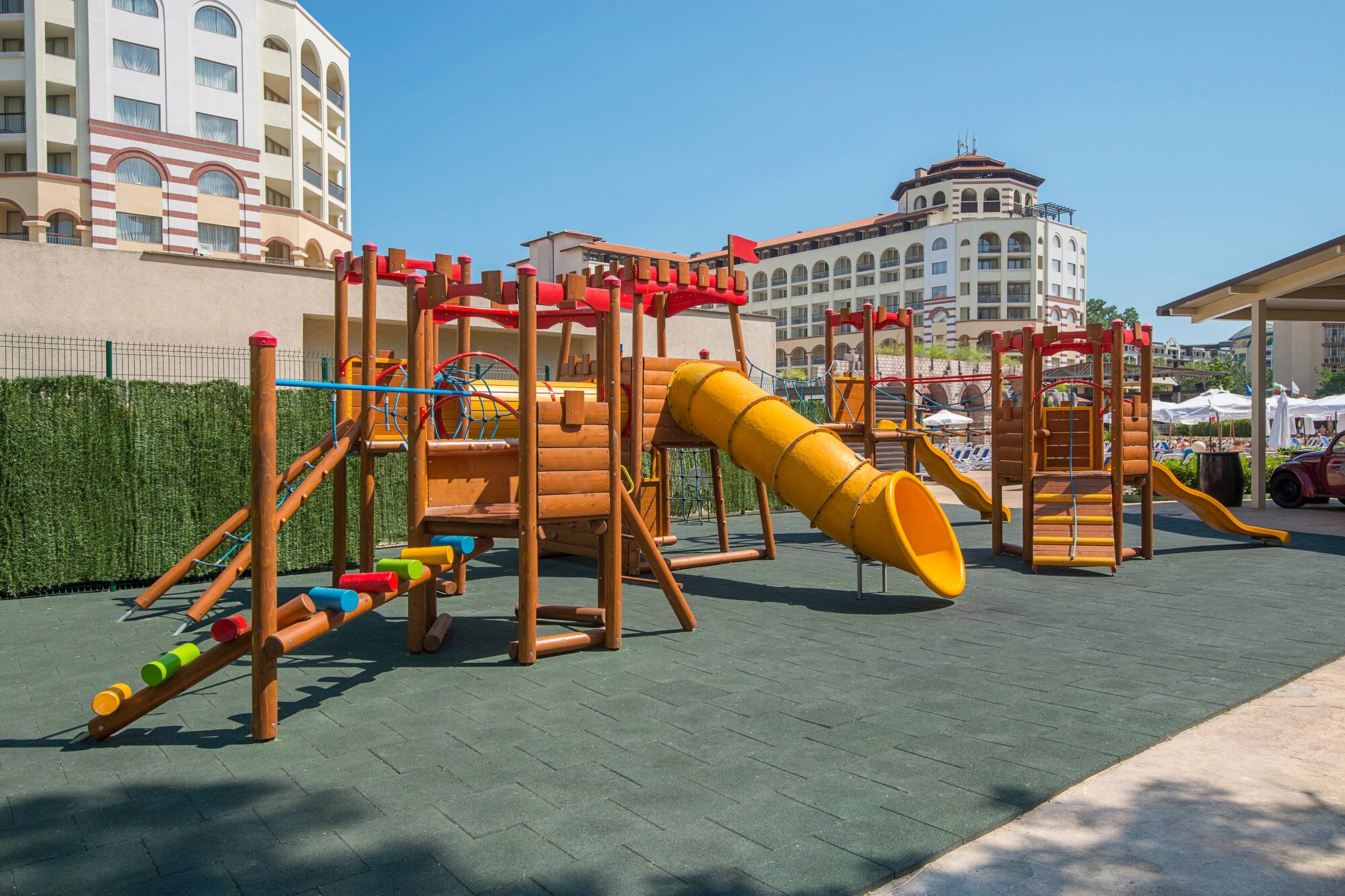 a playground with a slide and a slide