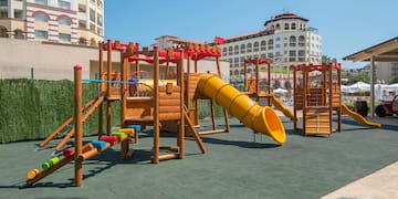 a playground with a slide and a slide