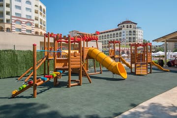 a playground with a slide and a slide