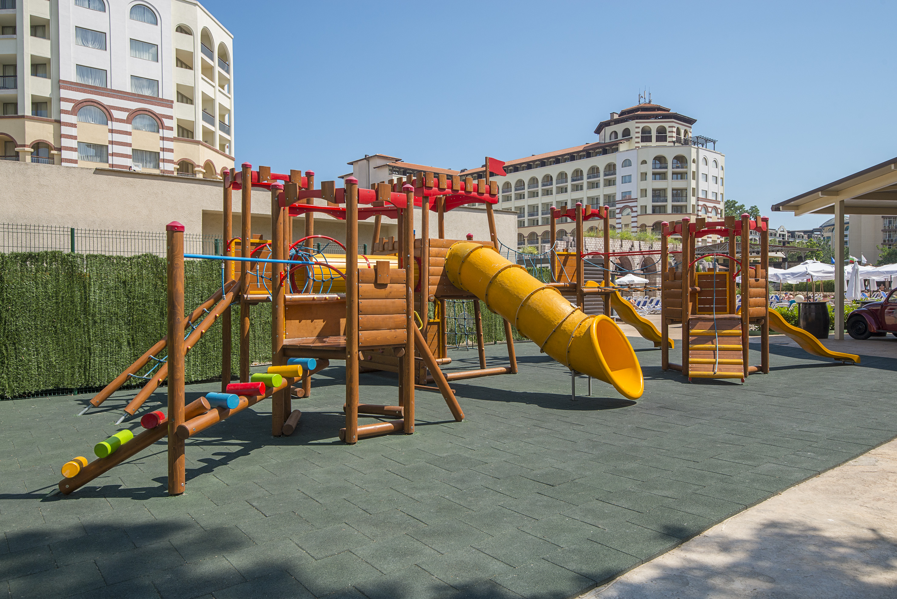 a playground with a slide and a slide