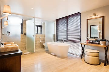 a bathroom with a tub and a sink