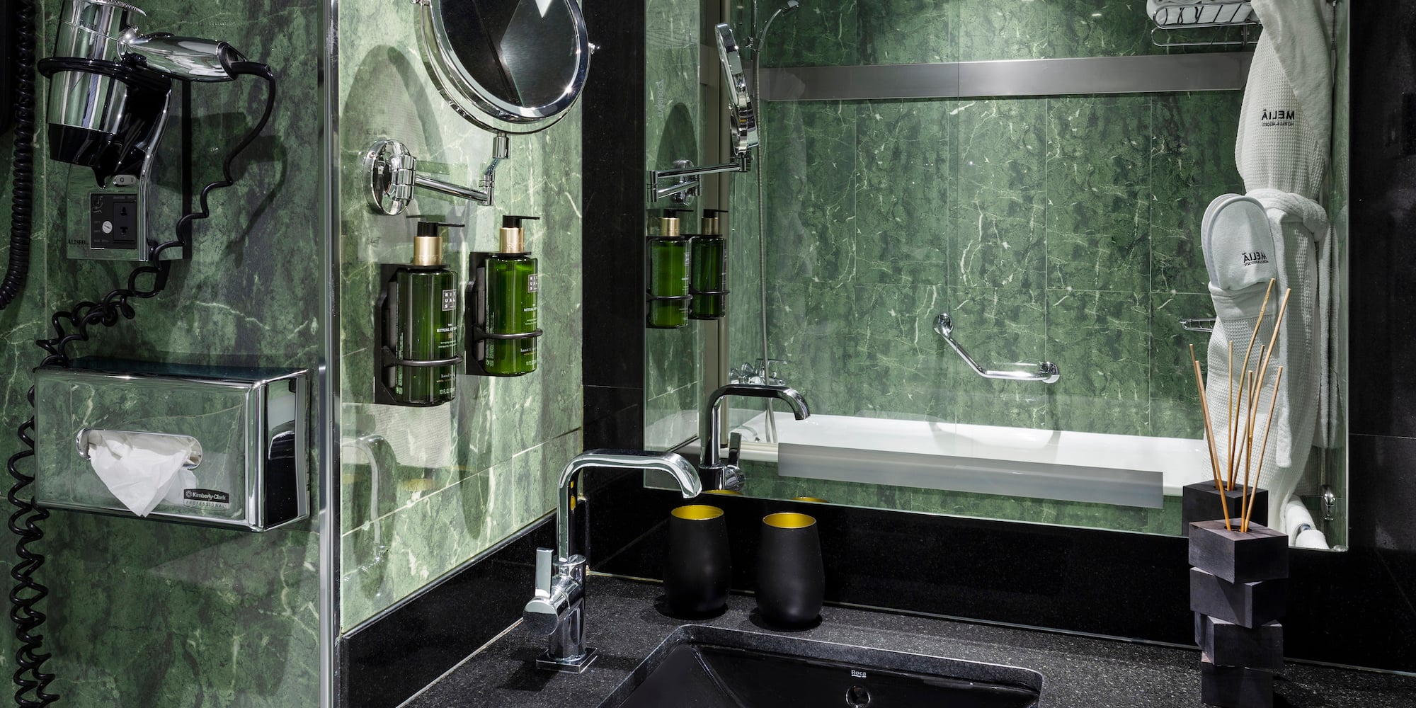 a bathroom with a sink and mirror