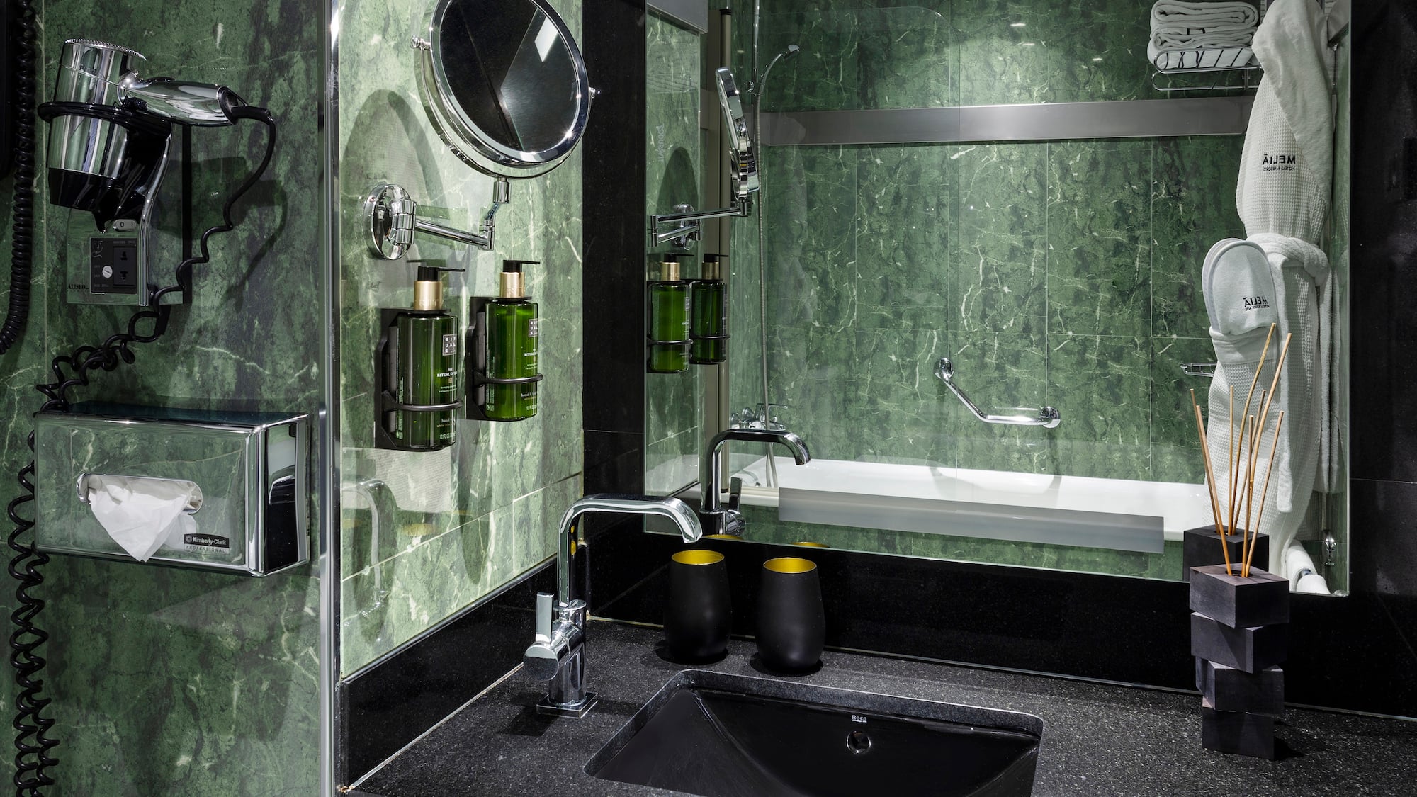 a bathroom with a sink and mirror