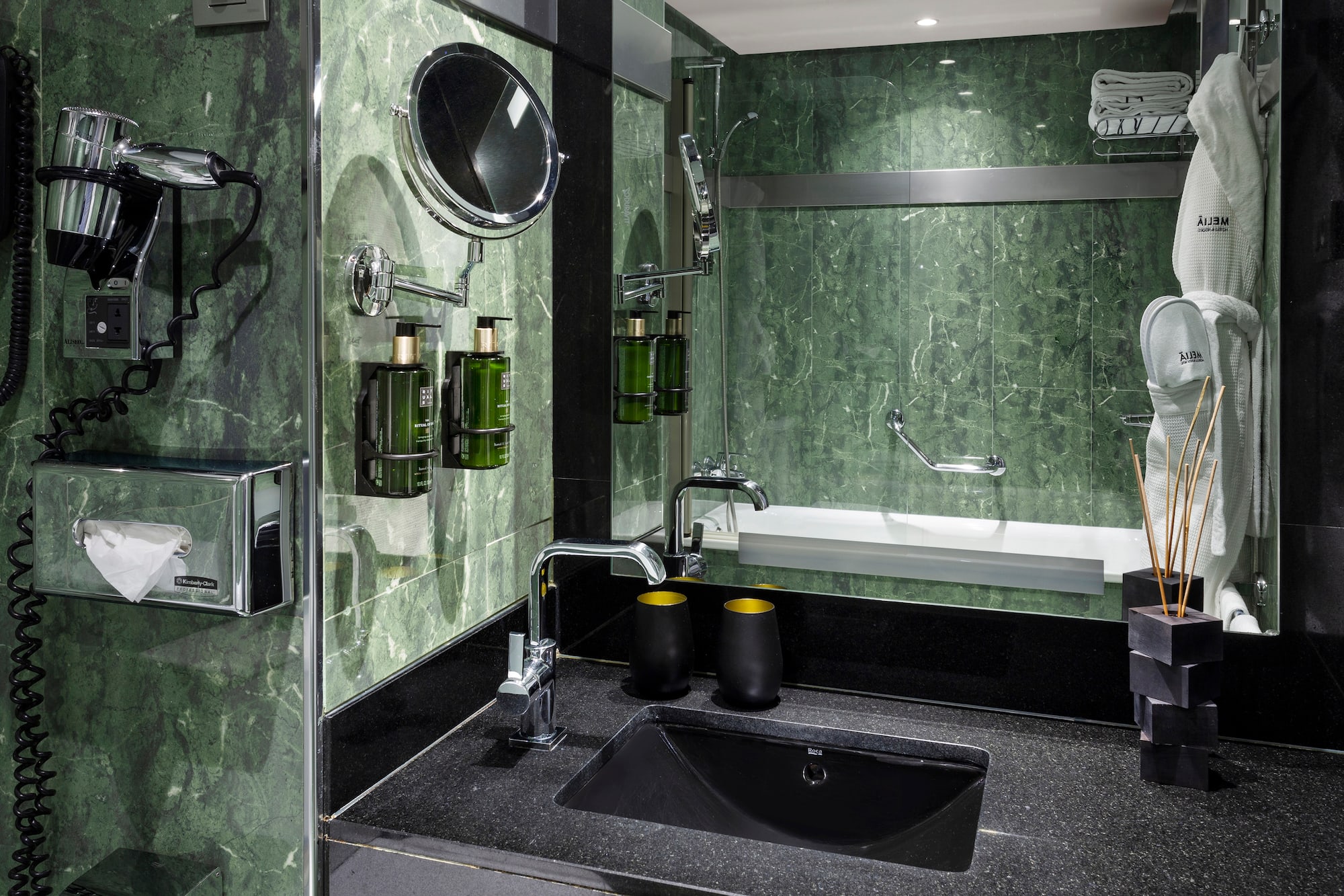 a bathroom with a sink and mirror