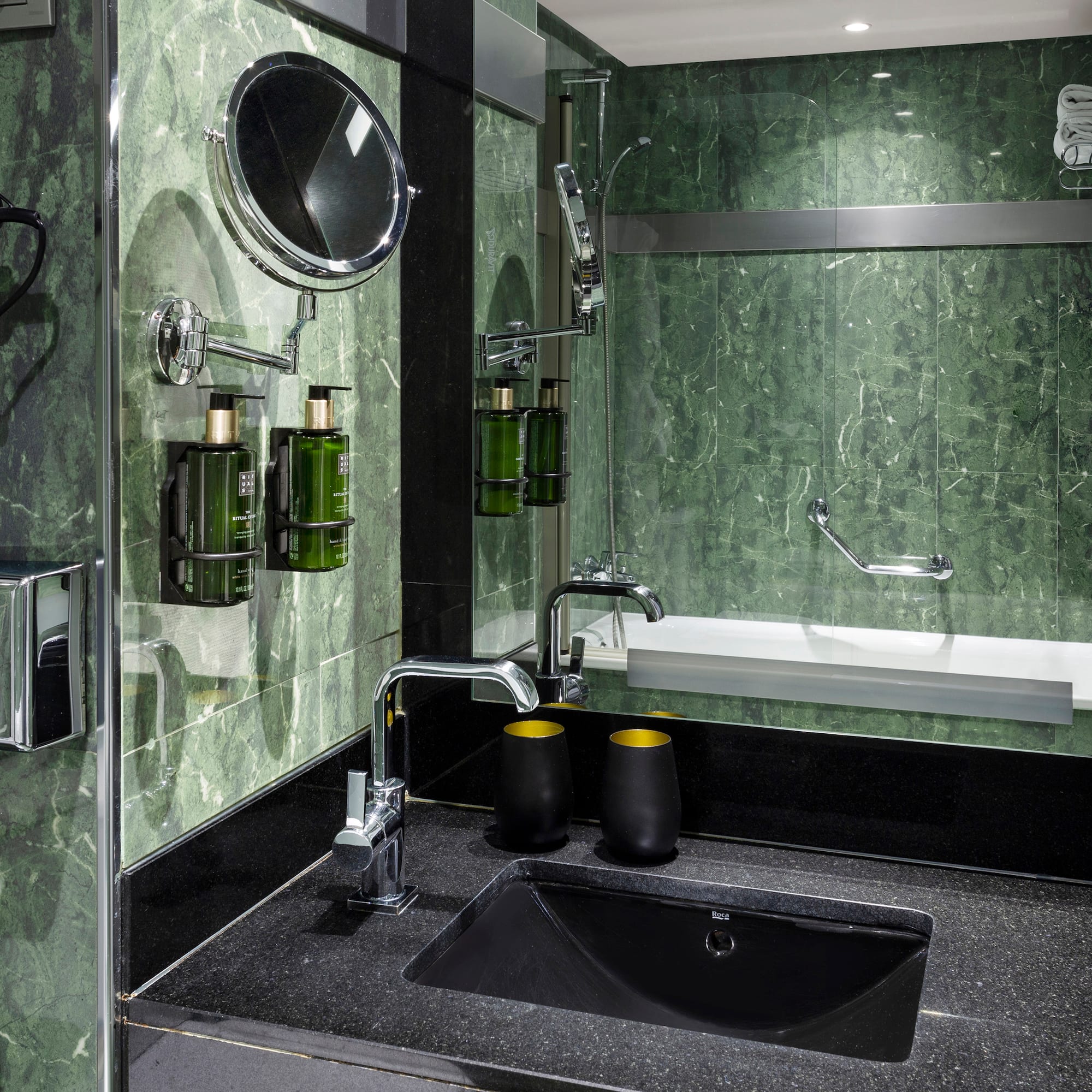 a bathroom with a sink and mirror