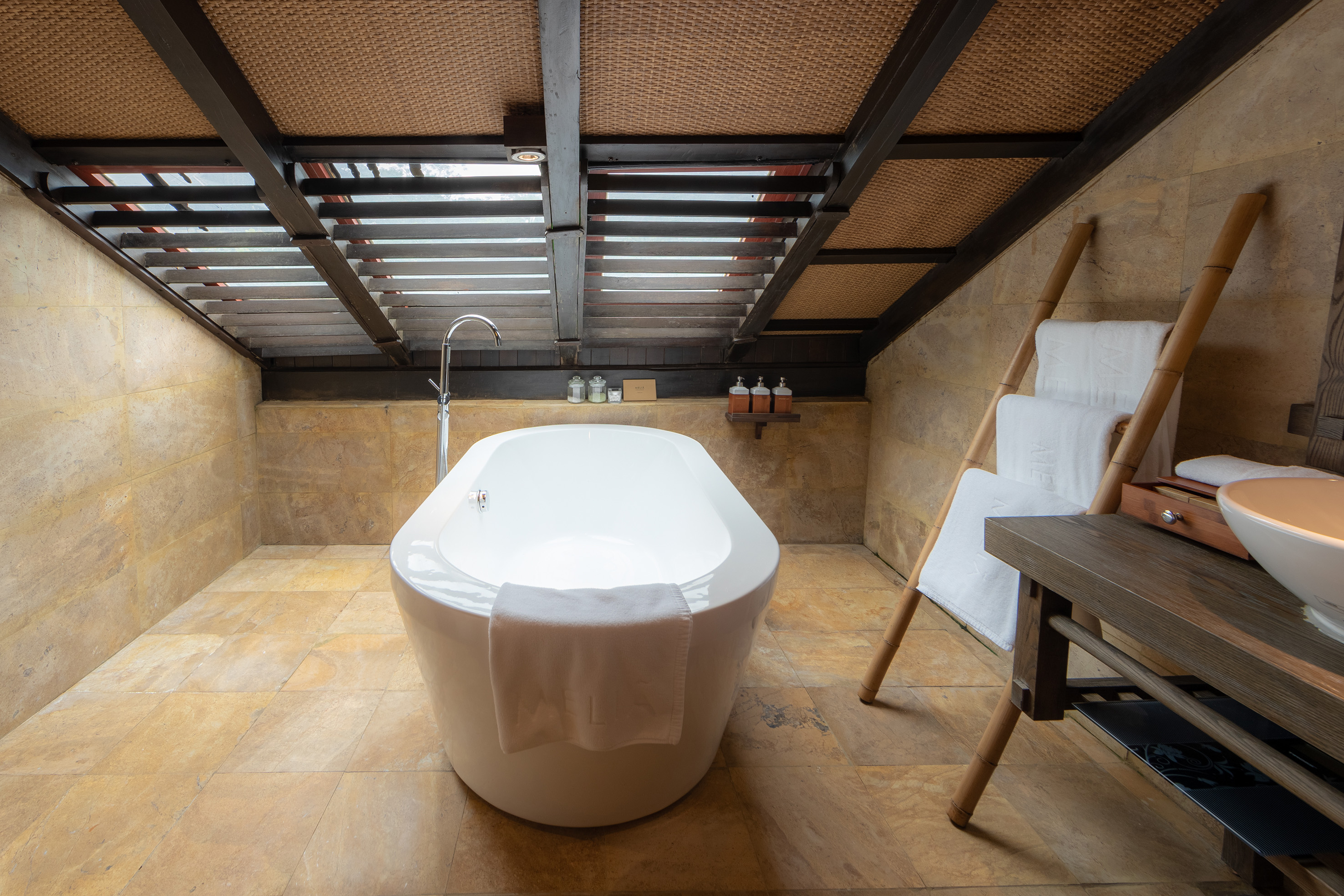 a bathtub in a bathroom - Family Master Suite - Meliá Ba Vi Mountain Retreat, Hanói