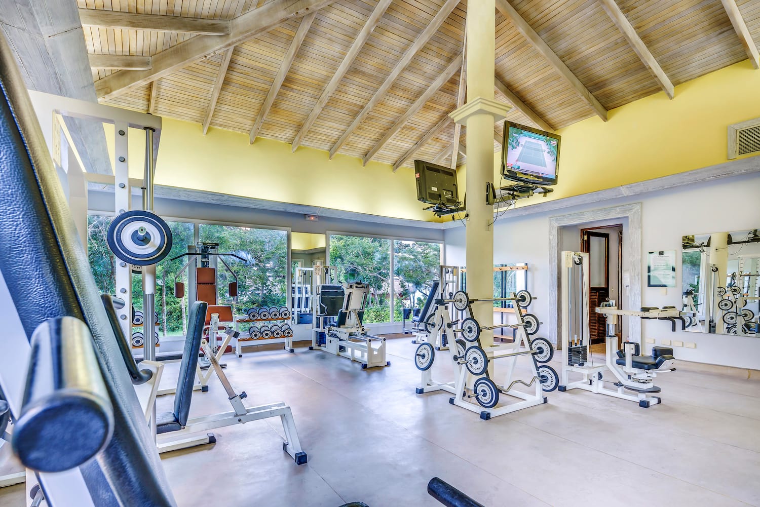 a large room with exercise equipment