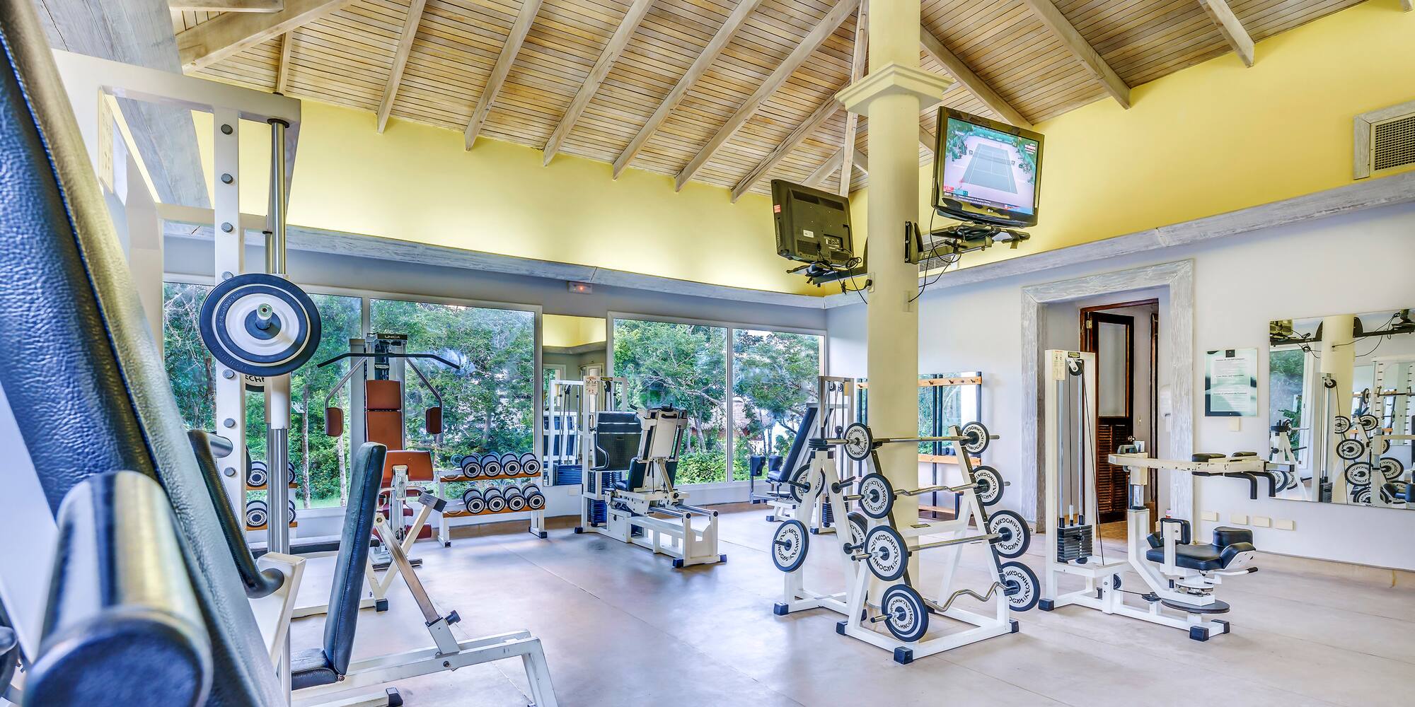 a large room with exercise equipment