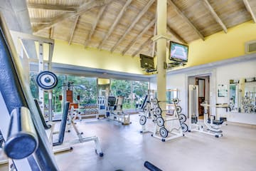 a large room with exercise equipment