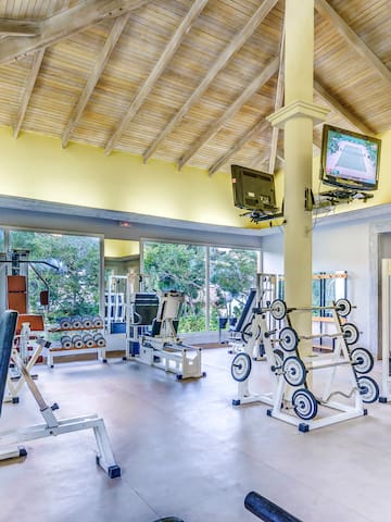 a large room with exercise equipment