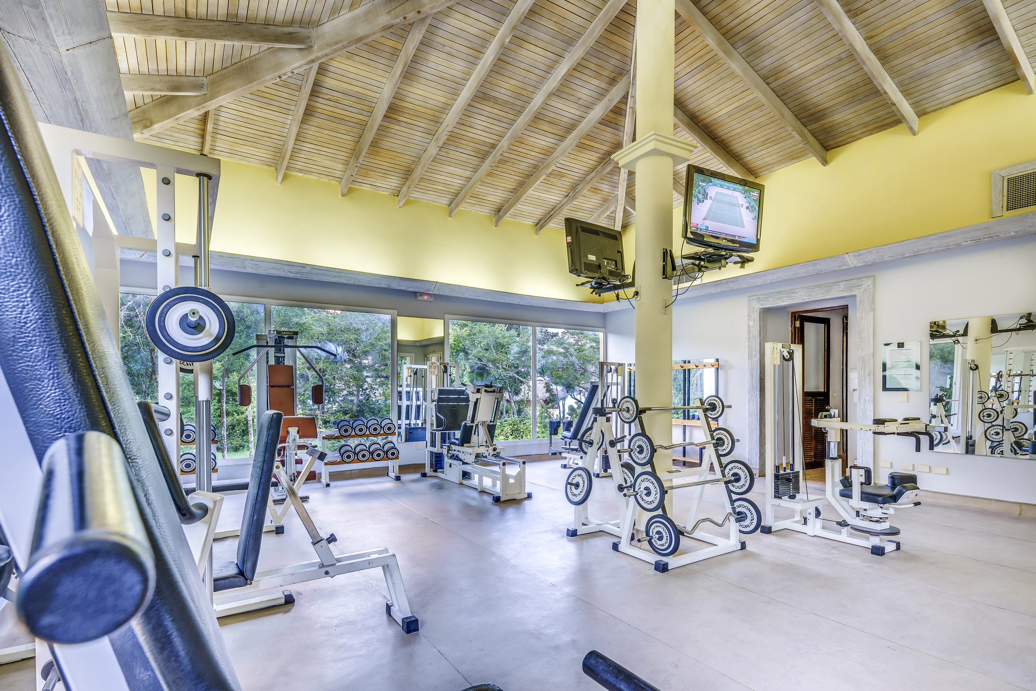 a large room with exercise equipment