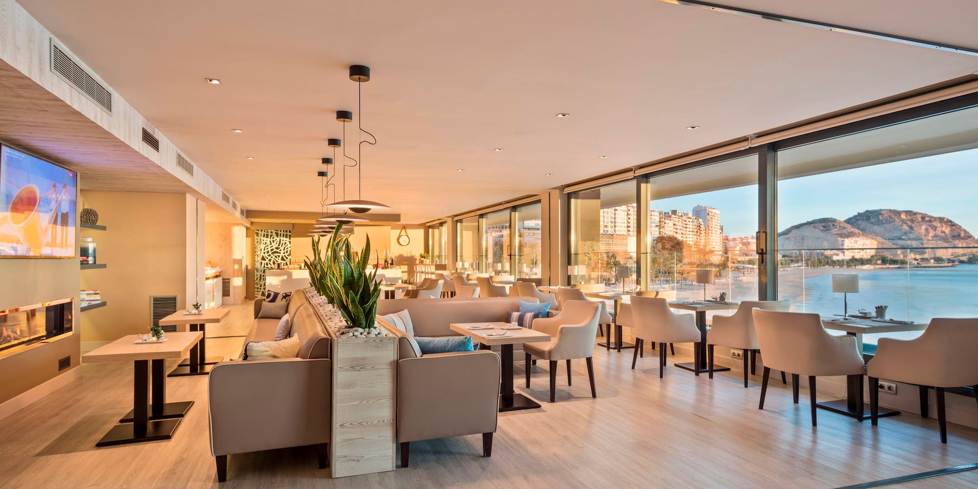 a room with a large window and a large couch