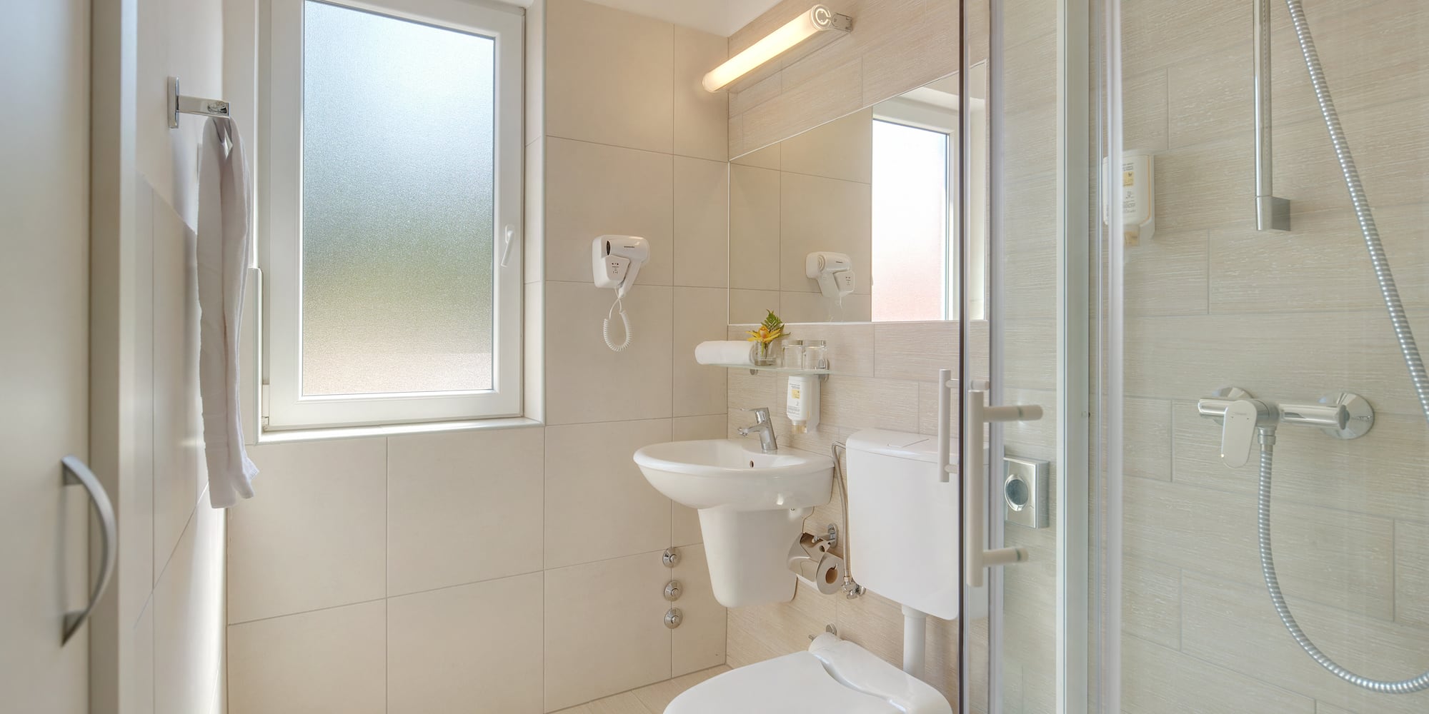 a bathroom with a shower and toilet