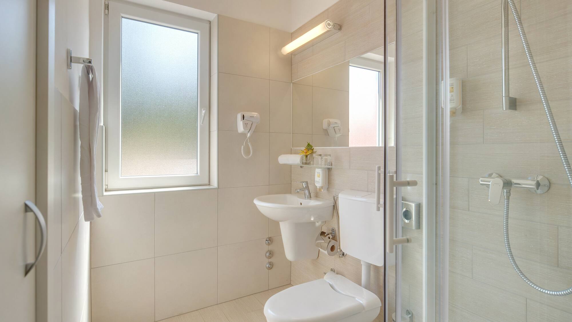a bathroom with a shower and toilet