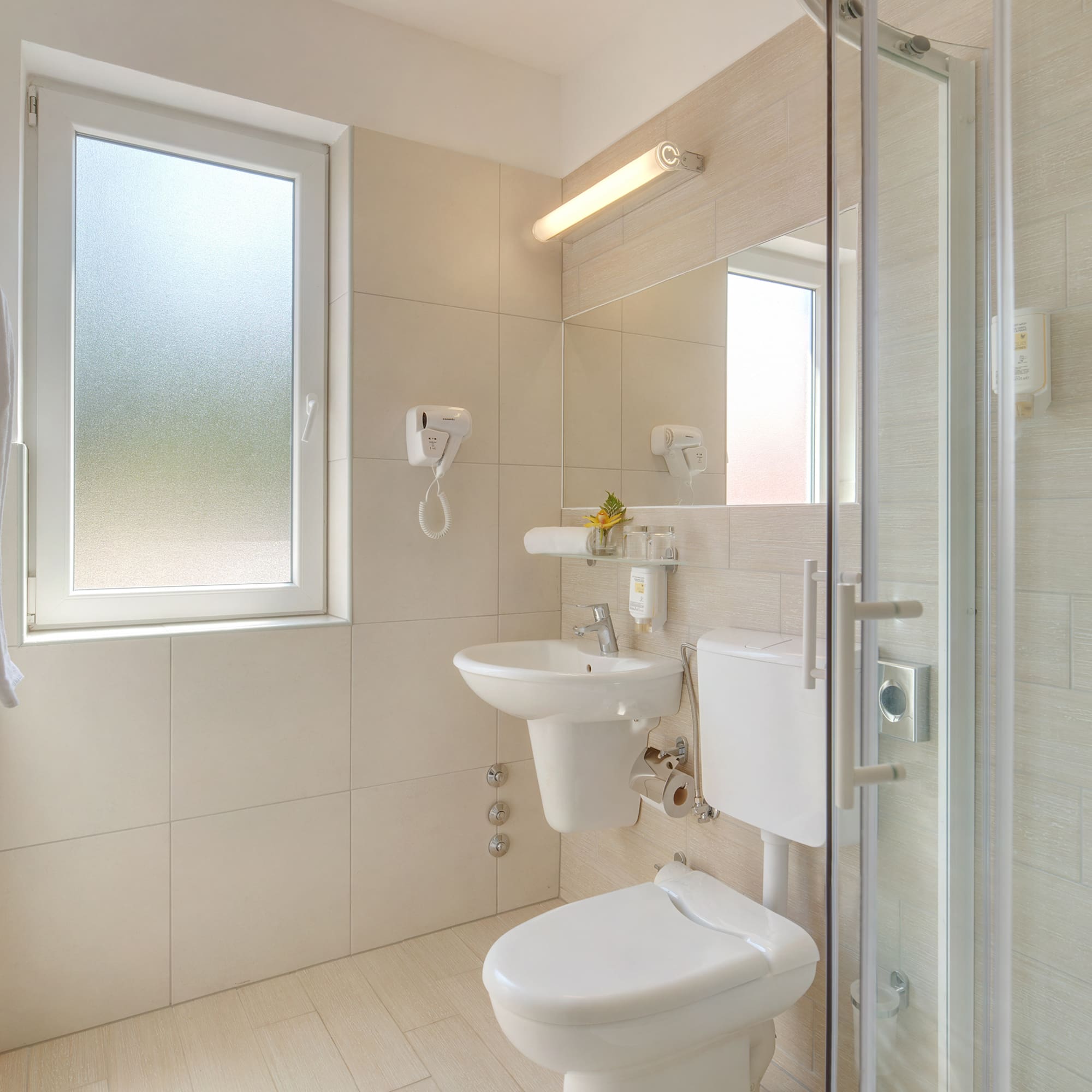a bathroom with a shower and toilet