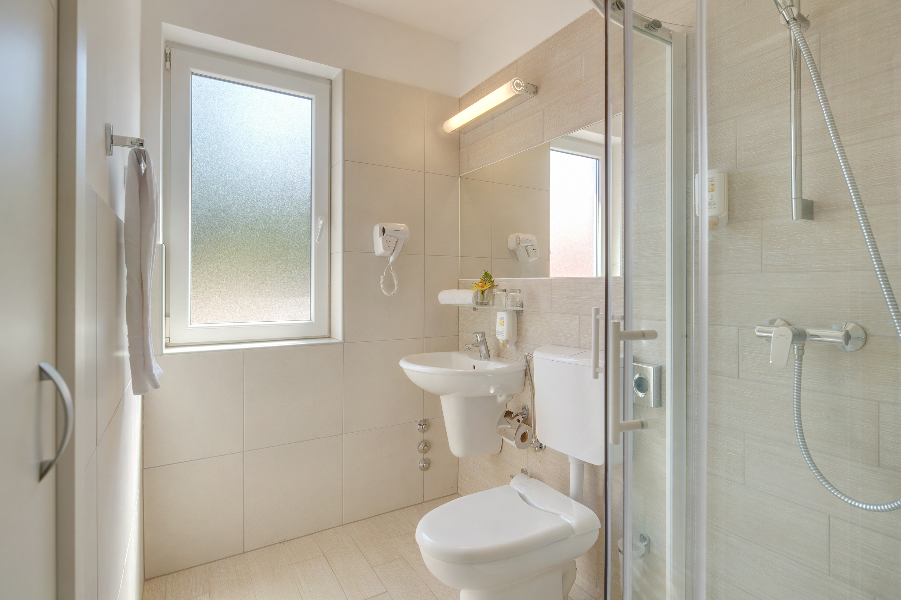 a bathroom with a shower and toilet