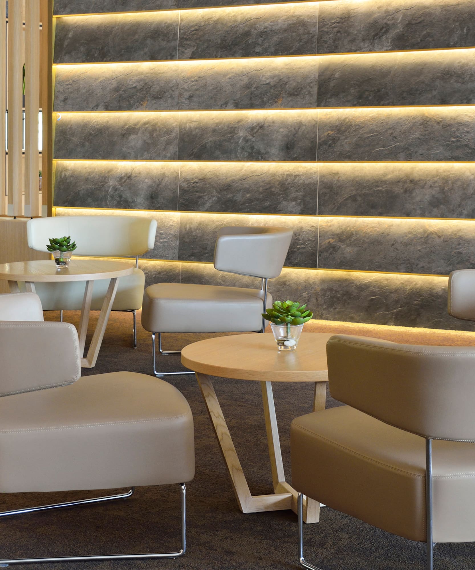 a group of chairs and tables in a room