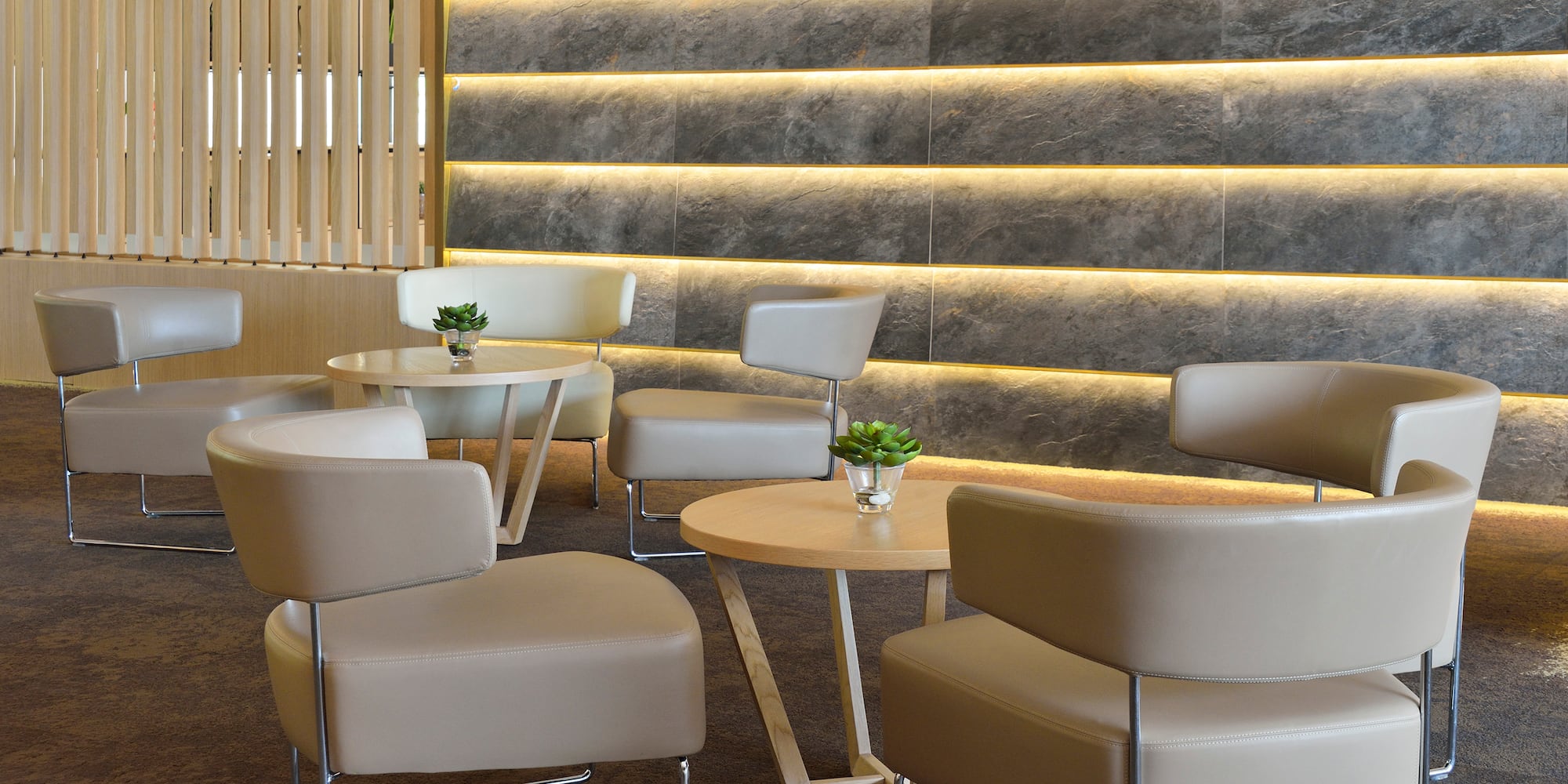 a group of chairs and tables in a room