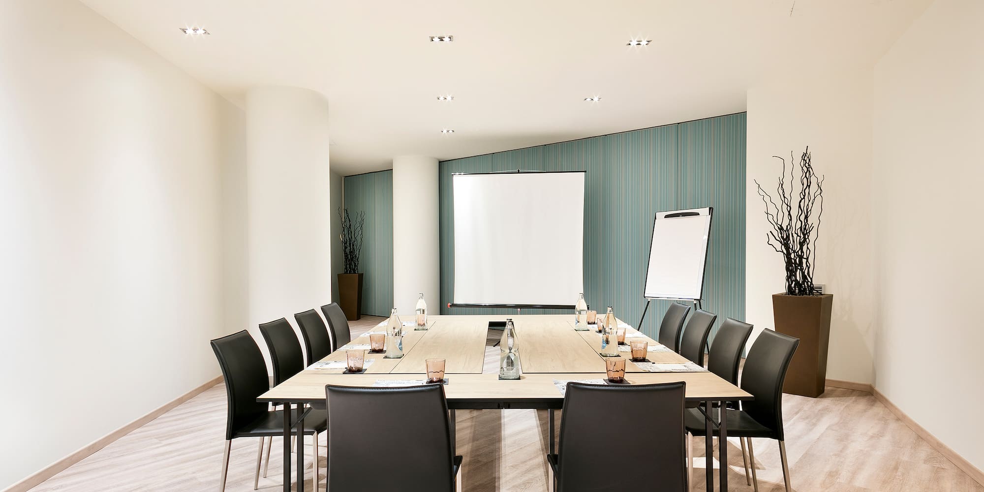 a conference room with a table and chairs