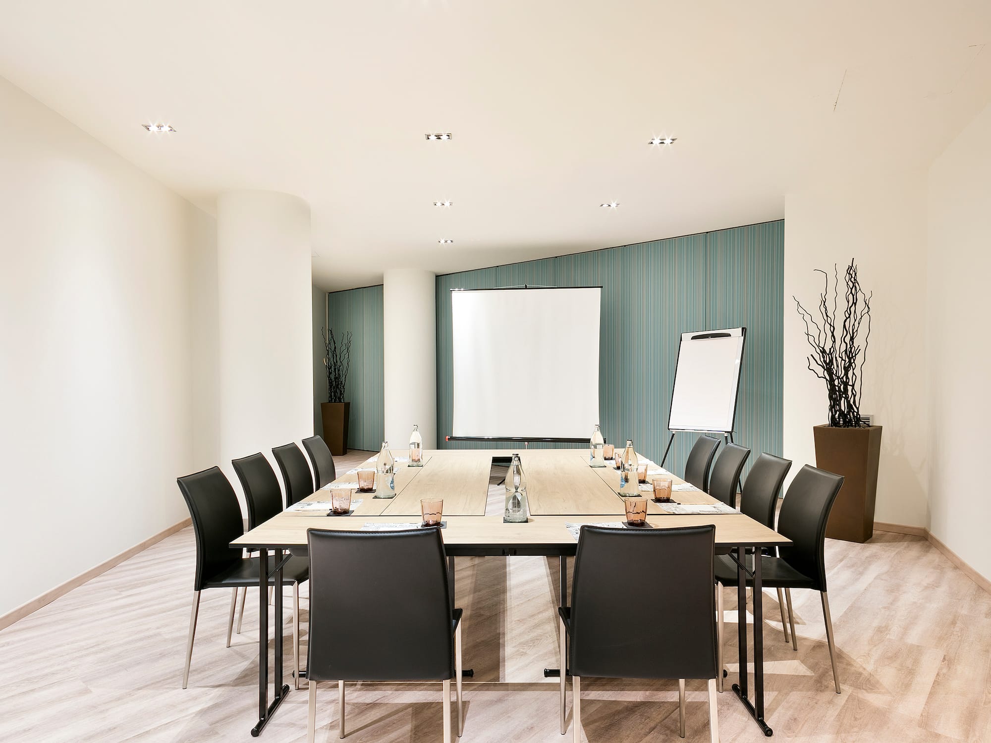 a conference room with a table and chairs