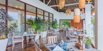 a restaurant with tables and chairs