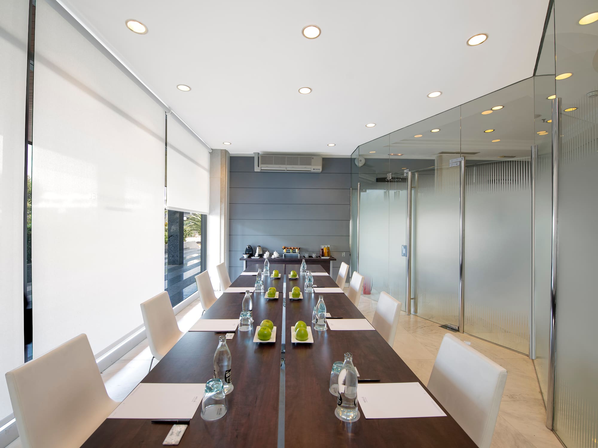 a conference room with a long table and chairs
