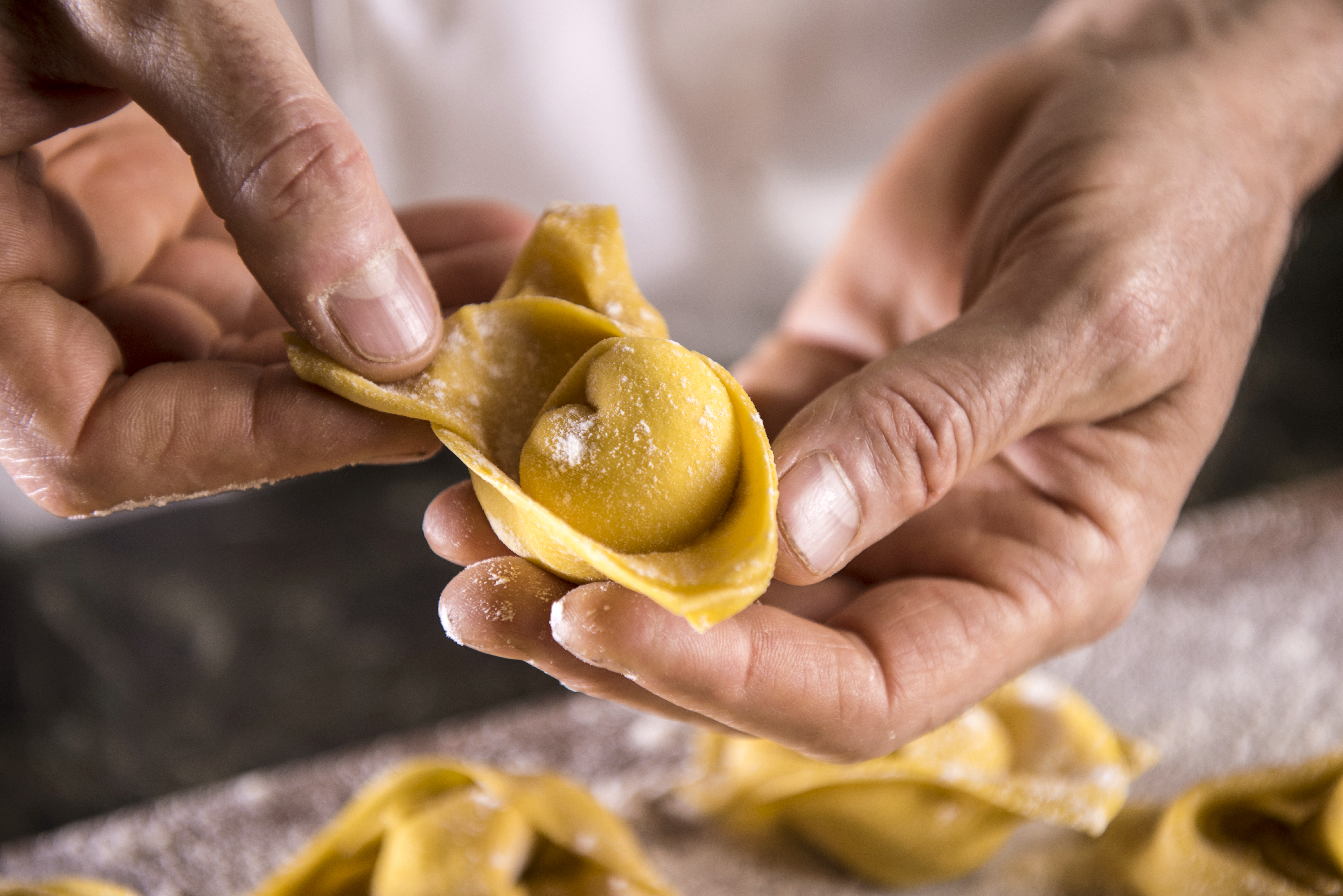 a person holding a tortellini