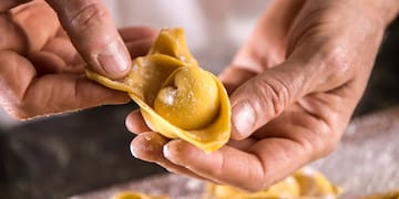 a person holding a tortellini
