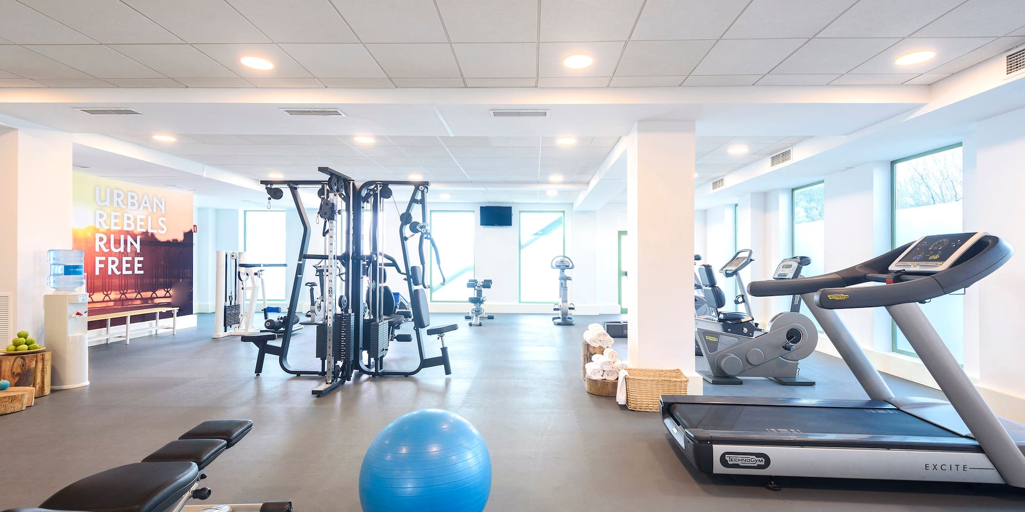 a large room with exercise equipment