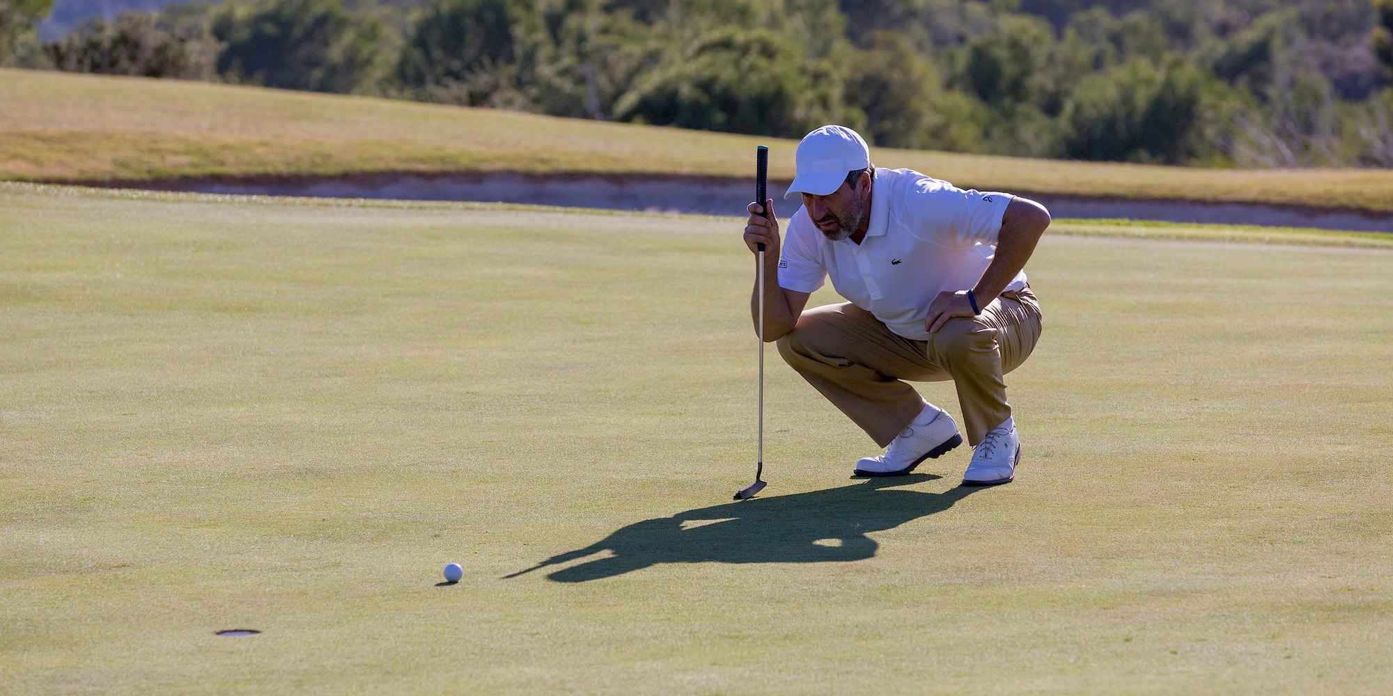 a man holding a golf club